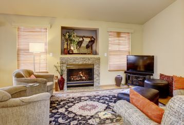 Woven wood blinds adding natural elegance to a Laguna Beach home.