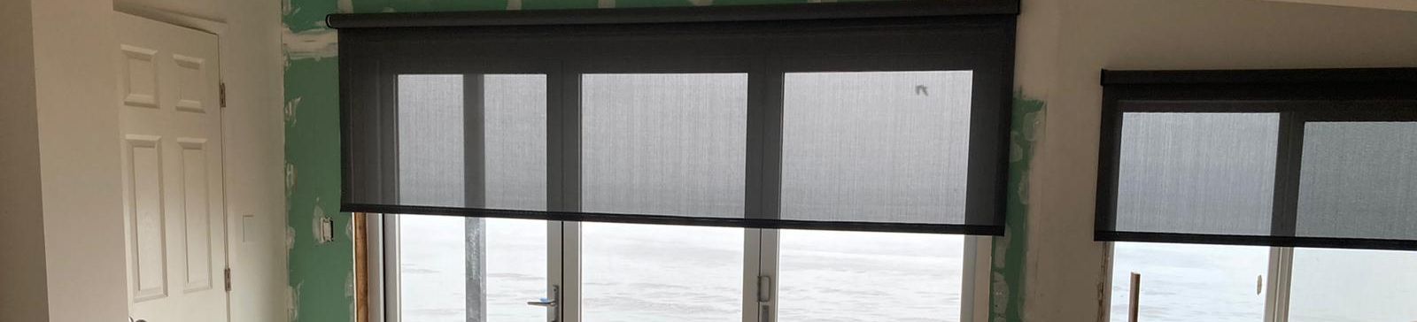Installing motorized roller shades in a luxury Laguna Beach vacation home.